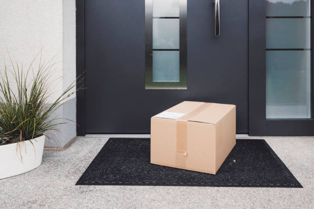 istock Delivery package left out at the front door - Surprise Christmas present 1449117997