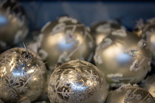 A close up of decorative Christmas baubles, with a shallow depth of field