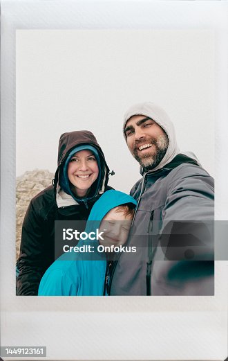 istock Happy Family Taking an Instant Selfie at Sulfur Skyline, Jasper, Alberta, Canada 1449123161