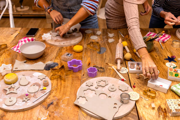 istock Ceramic workshop. Women of different ages work together making ceramic Christmas ornaments. 1449124956