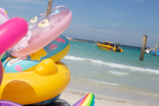 istock Inflatable rings on the beach. Summer concept 1449128370