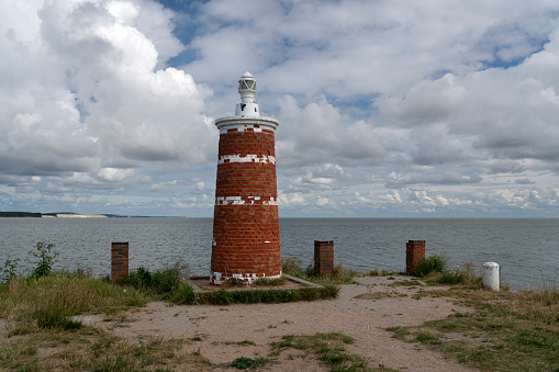 Lighthouse in the village of Rybachy on a sunny summer day, Curonian Spit, Kaliningrad region, Russia