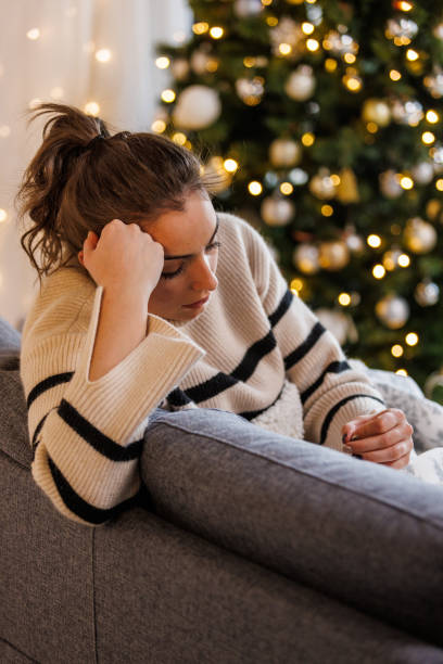 istock Sad young woman contemplating about Christmas holidays 1449129907