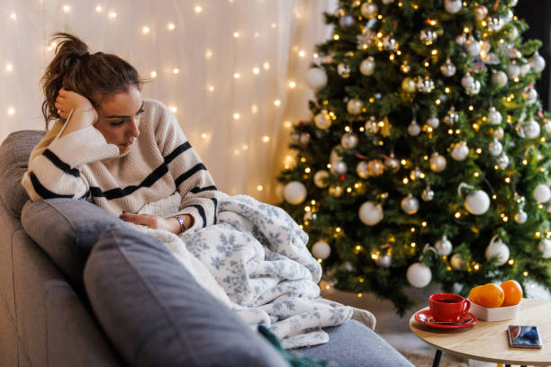istock Sad young woman contemplating about Christmas holidays 1449129909