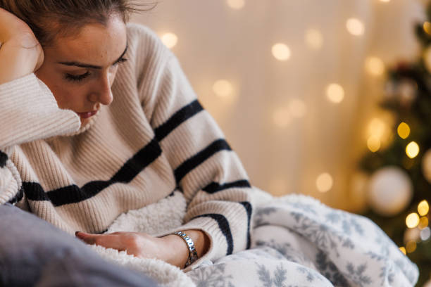 istock Sad young woman contemplating about Christmas holidays 1449129914
