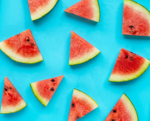 istock Sliced watermelon on blue background, top view. 1449132226
