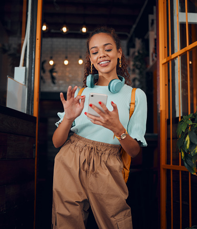 Happy gen z young woman with smartphone, social media fashion influencer in trendy cafe and youth culture in Miami. \nTrendy student communication, reading text on cell and 5g technology connection
