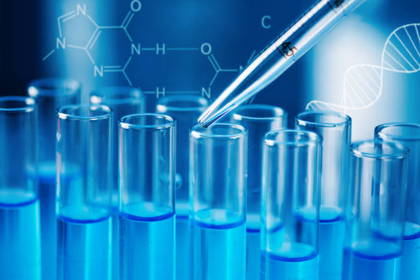 istock Test tubes with blue liquid water samples and pipette over blue background. 1449135785