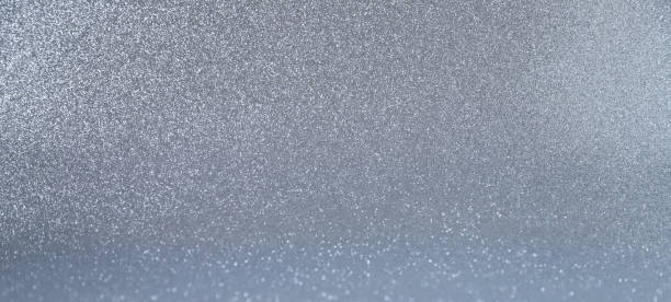 istock Sparkling silver glittery background. Photo in perspective with selective focus. Web banner with copy space 1449136683