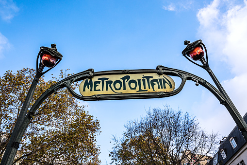 Paris, France, 10th of Dezember 2022: Old Art deco Metro sign in vintage look in Paris, France .