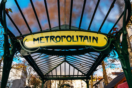 Paris, France, 10th of Dezember 2022: Old Art deco Metro sign in vintage look in Paris, France .