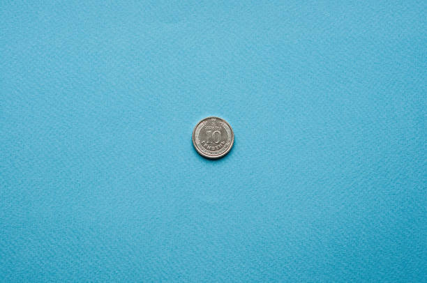 istock one coin on a blue background money 1449140283