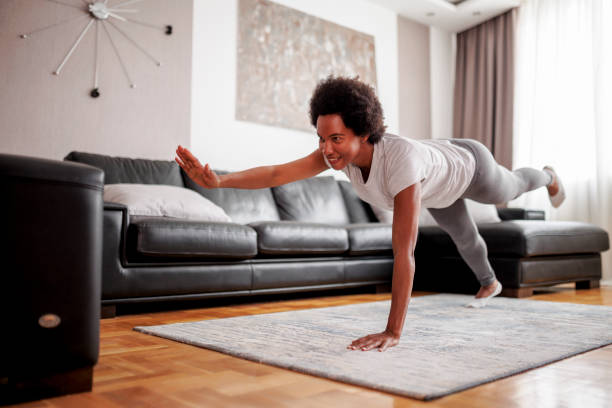 istock Woman doing yoga at home 1449142105