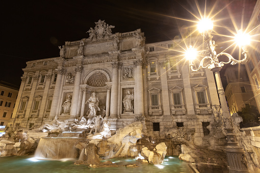 Rome, Italy - November 1, 2016: crowd of tourists and Trevi Fountain in Rome city. It is it is the largest Baroque fountain in the Rome and one of the most famous fountains in the world.