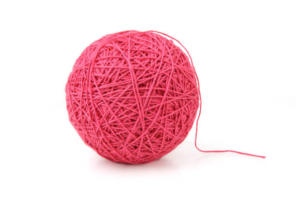 istock Pink big cotton thread ball isolated on white background. 1449146156