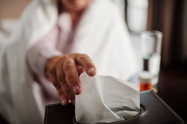 istock Senior Man Blowing Nose 1449149865