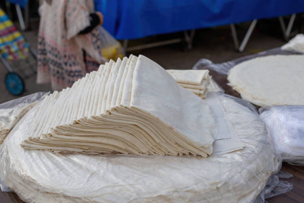 Handmade phyllo dough sold in the market. stock photo