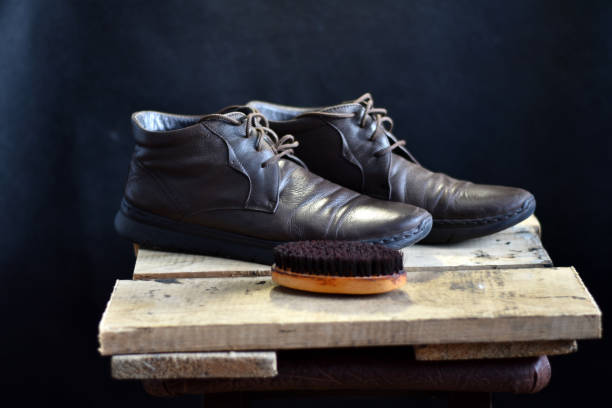 istock Old shoes and a brush to clean them. 1449157946
