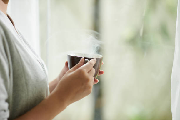 istock Woman Drinking Hot Coffee 1449158757