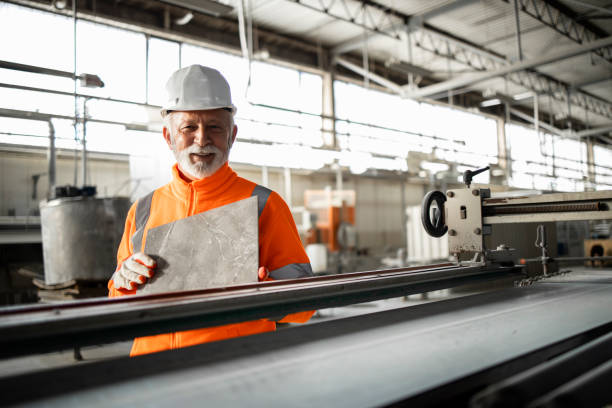 istock Successful ceramic tile production and factory worker doing quality control. 1449161569