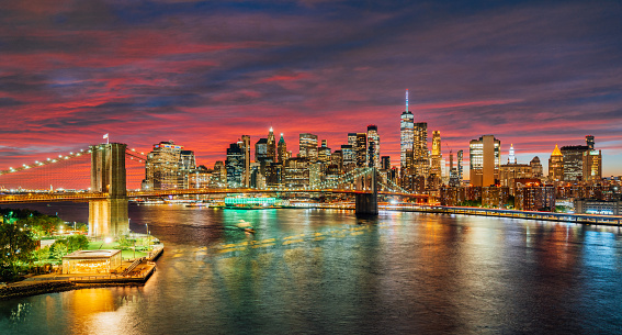 New York City skyline from elevated point of view. Colorful sky at sunset. Manhattan skyline seen from Manhattan Bridge.