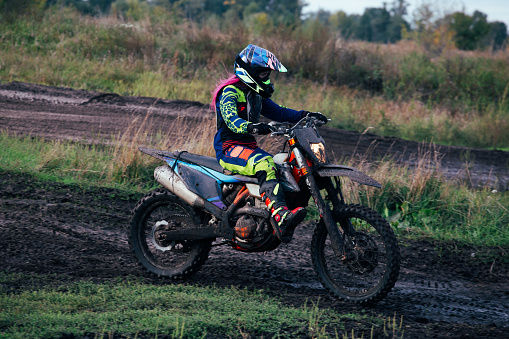 Motocross rider on his stunt bike spending a day in nature.