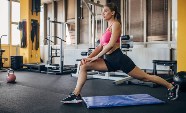 istock Woman exercising in gym 1449168877
