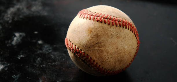 istock Baseball banner background with old used ball 1449169521
