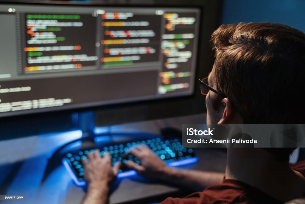 Coding Behind Computers Back View Of Man Coding For Cyber Security Programming And Working From ...