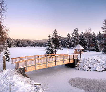 This area in Bavaria turns into a perfect winter wonderland with frozen lake Fichtelsee and snow covered rock formations like großer Waldstein in the beautiful forest