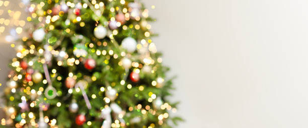 istock Defocus blurred background with elegant fir, garlands, highlights. 1449171623