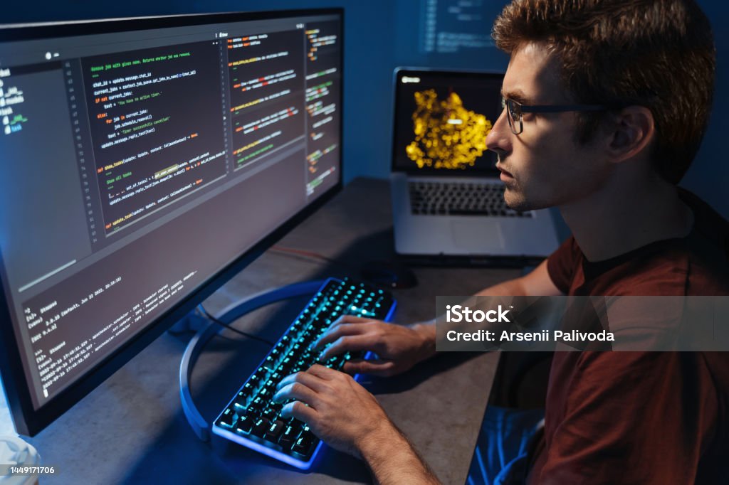 Profile View Of Young Developer Programming At Home Office Writing Code ...