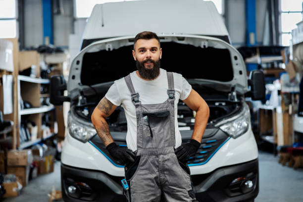 istock Portrait of happy auto mechanic at workshop. 1449174422