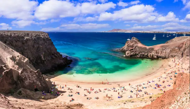 Photo of Lanzarorote Canary islands beach scenery.  popular scenic Papagayo beach in the south near Playa Blanca