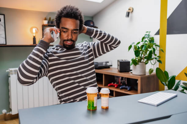 istock Young man talking on the phone with his doctor 1449180311
