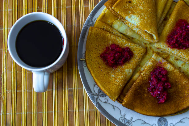 Carnival, a cup of coffee and pancakes for breakfast. High quality photo