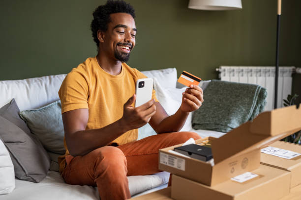 istock Young man using smart phone to shop online 1449180823