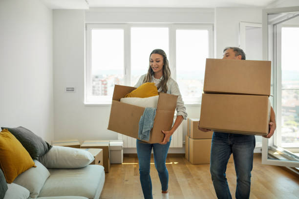 istock Young couple moving in together. 1449183112