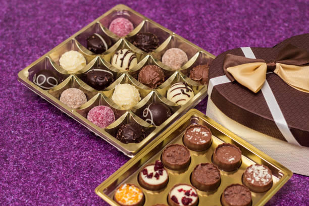 istock Box with delicious chocolate candies and heart shape gift 1449190230