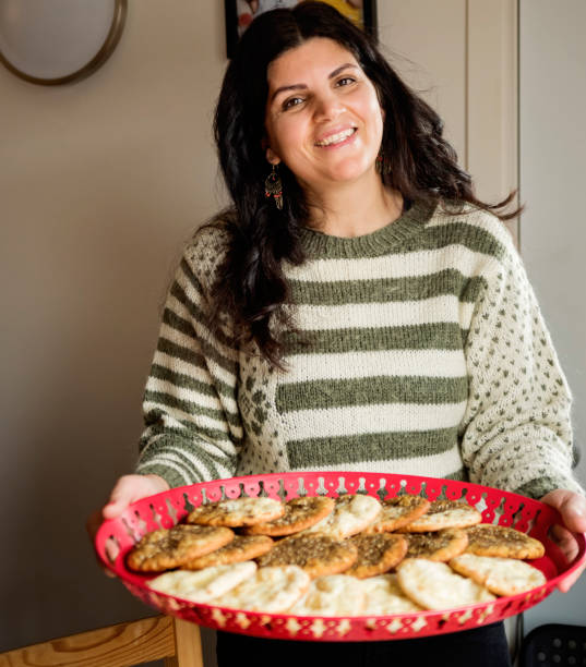 istock Middle eastern woman bringing mahakish for a festive breakfast. 1449190621