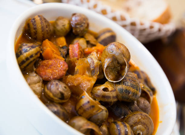 istock Homemade stewed escargots with chorizo 1449191113
