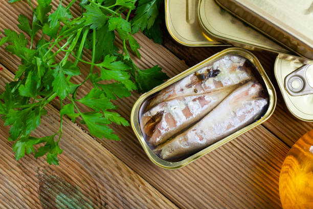 istock Preserved mackerel fish on wooden table 1449191209