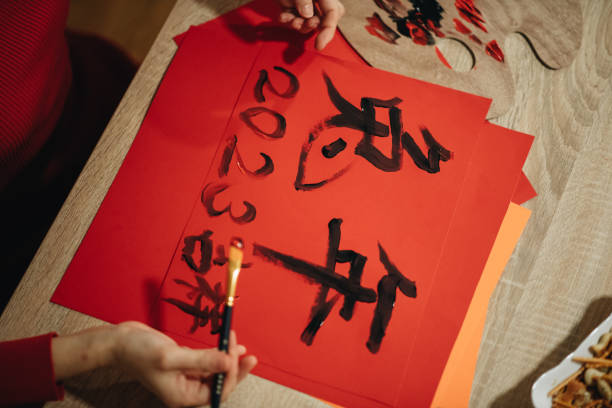 istock Close-up of a woman making well wishes cards using Chinese script 1449191466