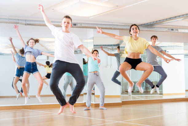istock Teenagers jumping together during dance workout 1449193258