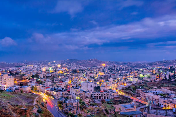 Bethlehem Cityscape Palestine Israel Night Cityscape of Bethlehem, Palestine, Israel at night. bethlehem west bank stock pictures, royalty-free photos & images