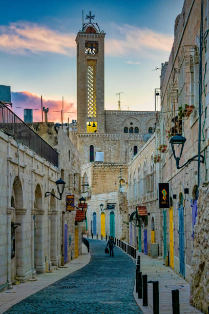 The stone-built alley with the arch and stairs deep in Jerusalem Old Town in Jerusalem, Israel.