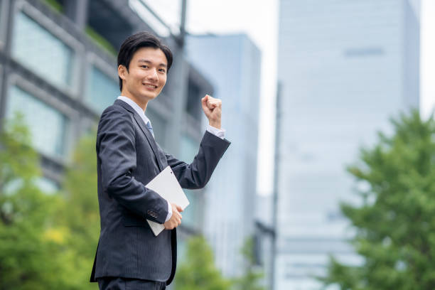 istock Businessman with tablet in business district 1449201575