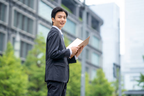istock Businessman with file in business district 1449201602