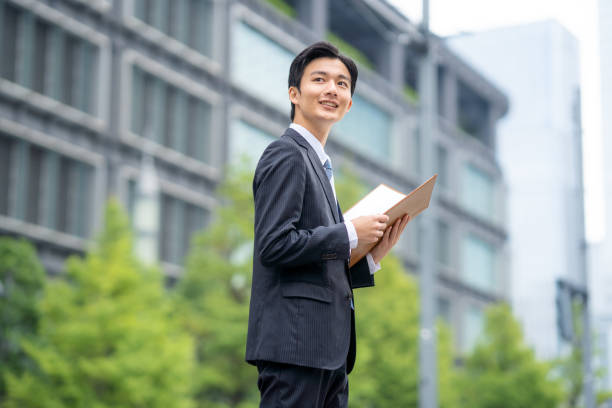 istock Businessman with file in business district 1449201622