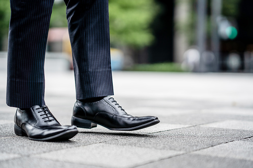 Leather shoes of a walking businessman